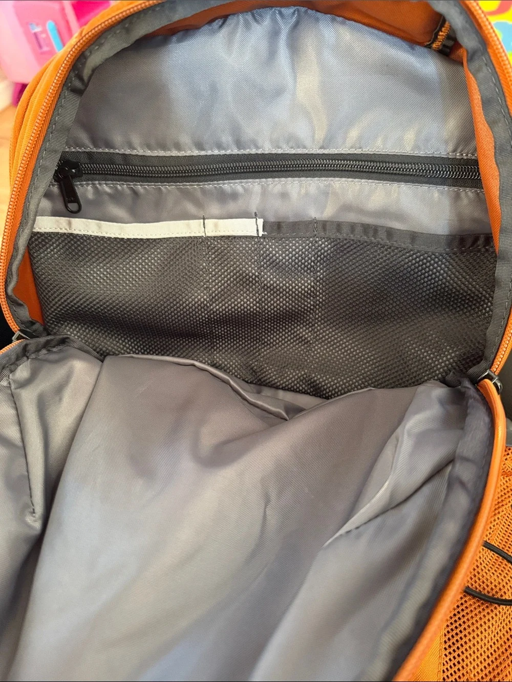 The North Face Jester Backpack in burnt orange with black accents